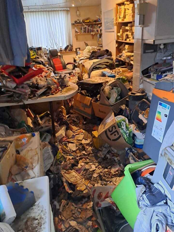 a huge pile of rubbish filling up a room in need of house clearance waste removal service due to hoarding